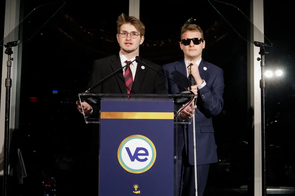 Two speakers at a Virtual Enterprises podium